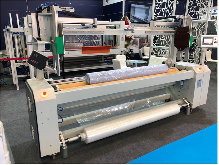 PK.350 - SEMI AUTOMATIC FABRIC ROLL PACKAGING MACHINE