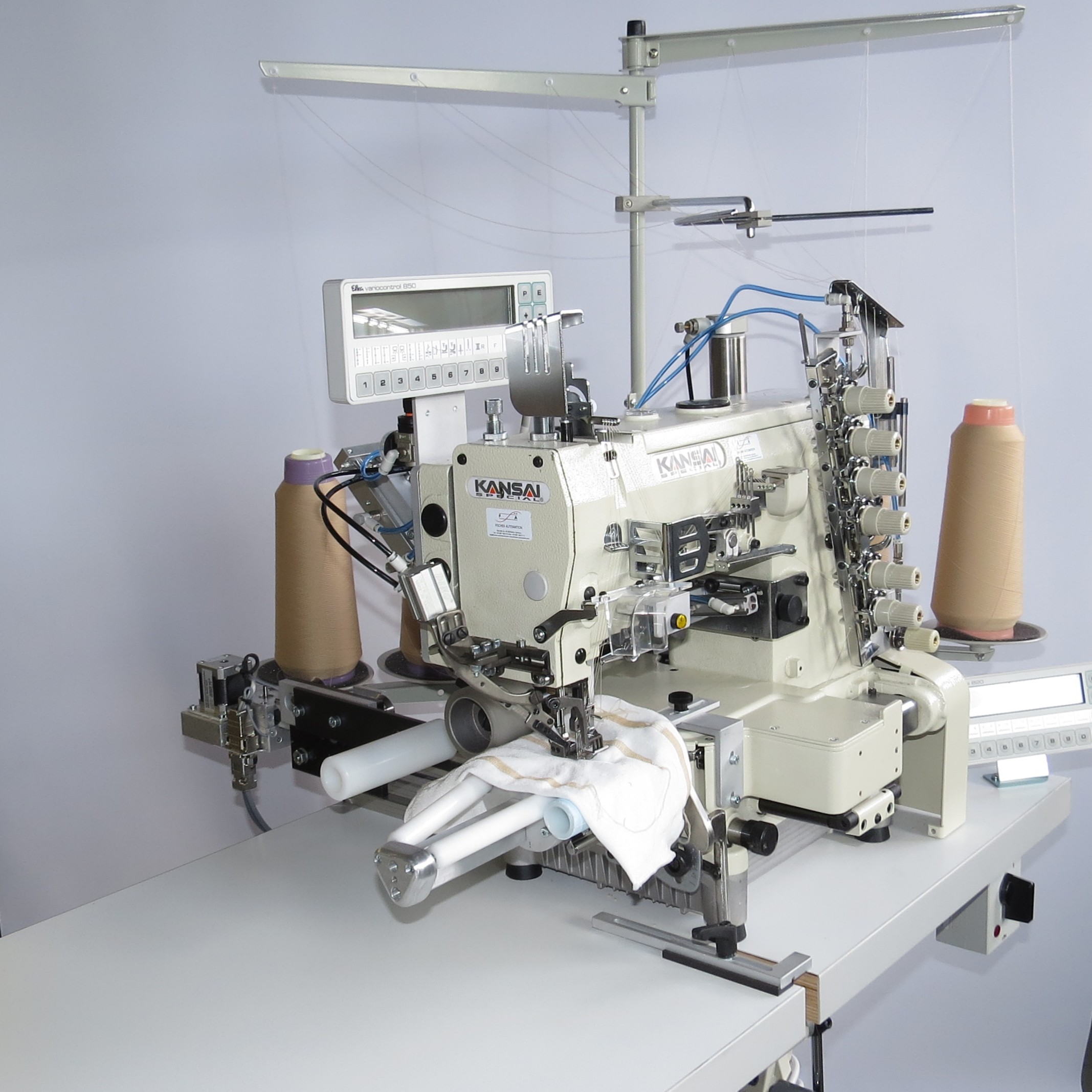 FOUR-NEEDLE INTERLOCK SEWING MACHINE